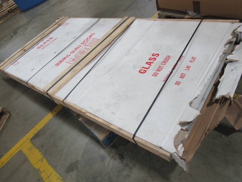 lot 252 image: Sliding Glass Patio door, Manufacturer unknown. Approximate measurements Each Door 36 12 X 94 Tall.