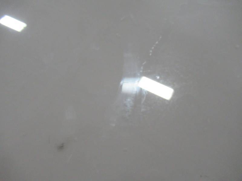 lot 412 image: Glass Patio Table Top With Umbrella Hole, Beige Backing. Measures 62 34 X 34 34 X 18 Thick. - Small Scratches