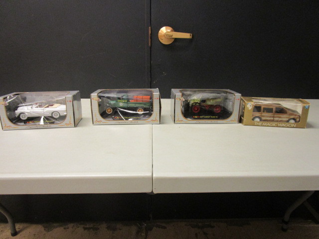 FOUR NEW DIE CAST MODEL CARS