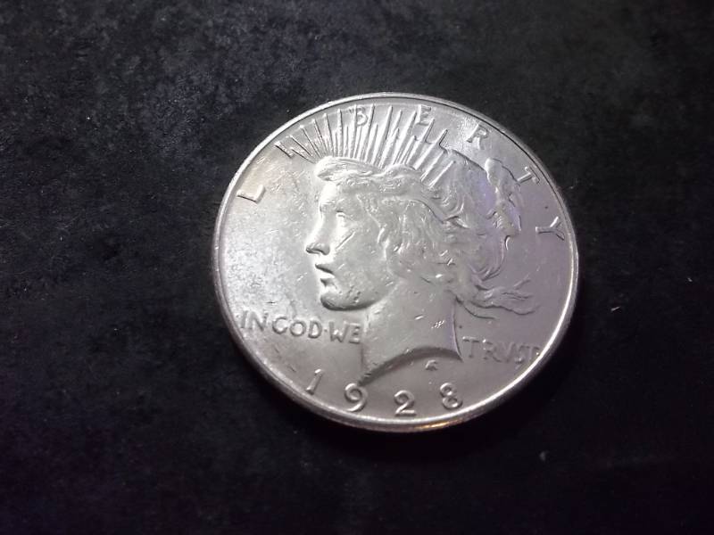 lot 57 image: 1928 S Silver Peace Dollar