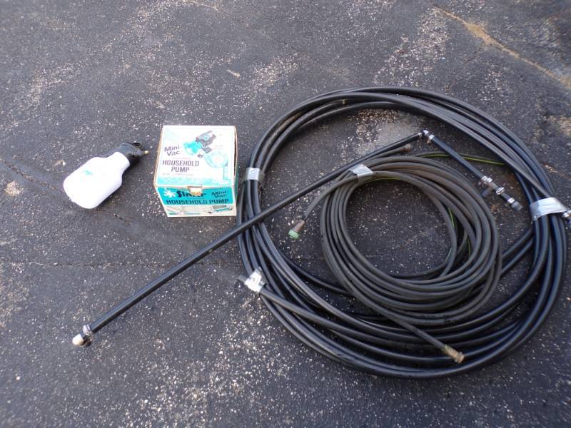 lot 25 image: Mini Vac Household Water Pump with PVC line and Soaker hose
