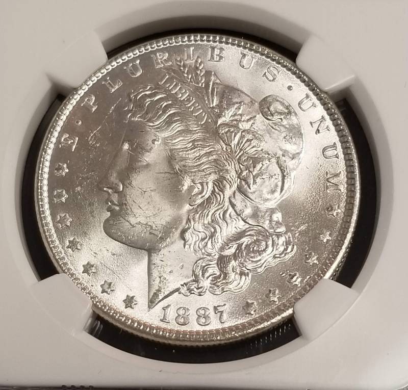 lot 30 image: 1887 MORGAN SILVER DOLLAR MS63 NGC
