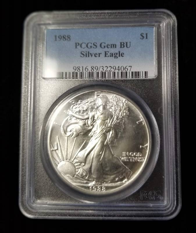 lot 42 image: 1988 AMERICAN SILVER EAGLE 1 TROY OZ. .999 FINE SILVER MS69 NGC