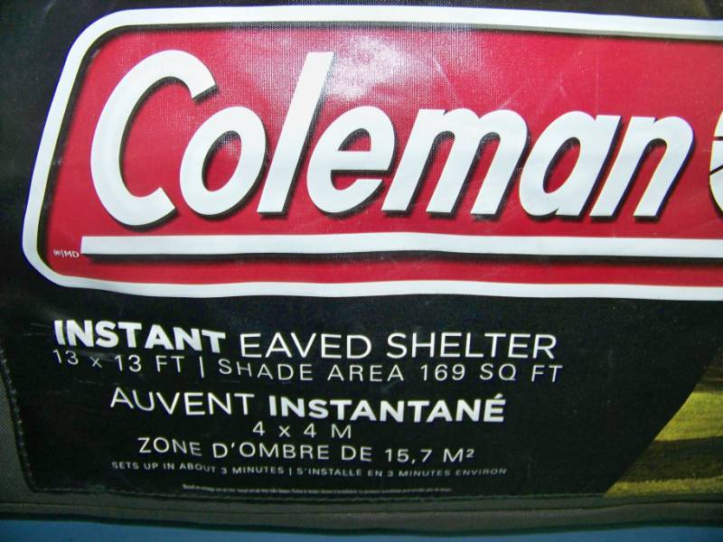 lot 43 image: Coleman Instant Eaved Shelter in Carrying Bag with Wheels
