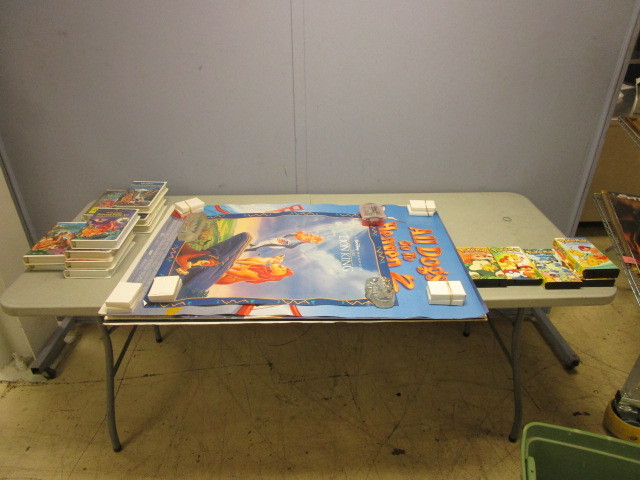 lot 658 image: CHILDRENS FILM POSTERS AND VHS TAPES