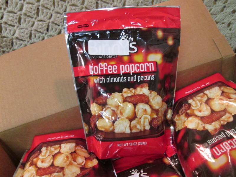 lot 44 image: Case of 12 Bags of Toffee Popcorn w...