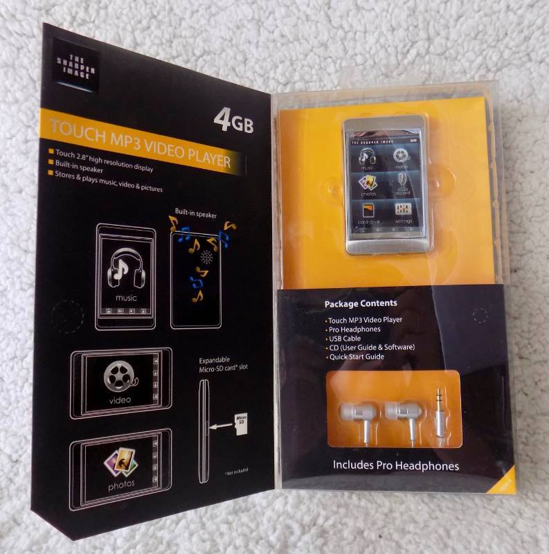 lot 3 image: (never used, in unopened package) Sharper Image Touch MP3 Video Player 4GB with Pro Headphones