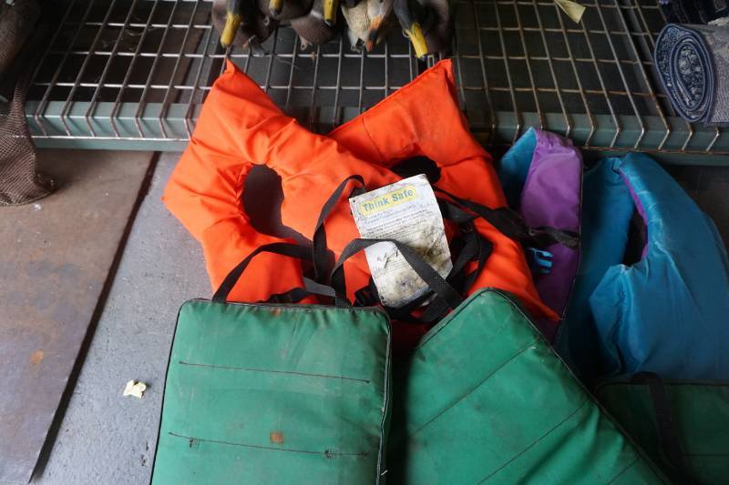 Lot of Life Jackets and Boat Cushions