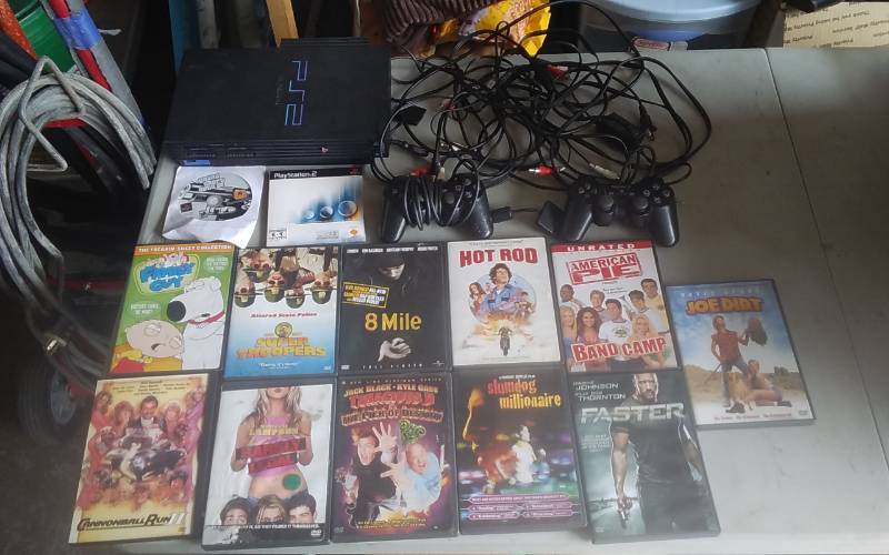 lot 48 image: Sony Play Station 2, 2-Remotes, 1-Game, 11-DVDs