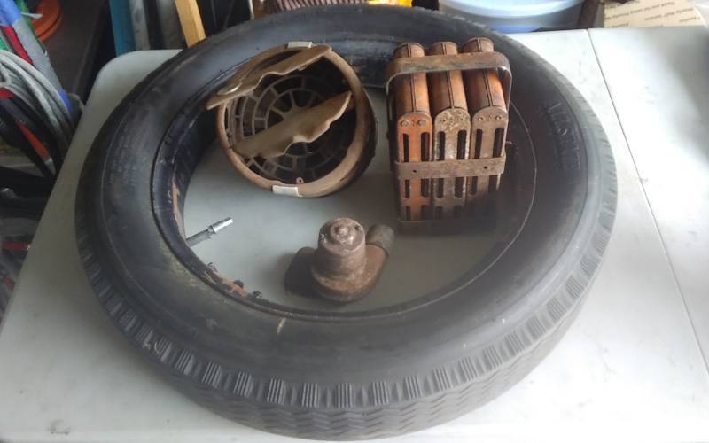 lot 51 image: Vintage Tire With Rim, Vintage Car Heaters