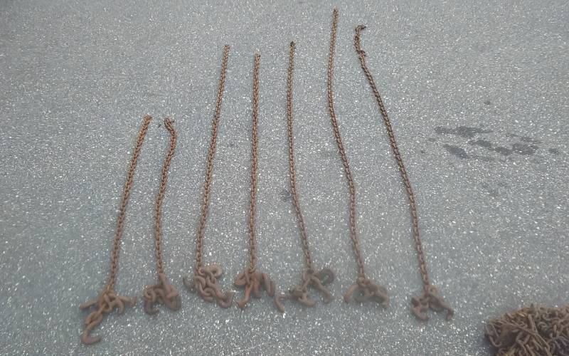 lot 54 image: 7-Assorted Chains With Tow Truck Ends