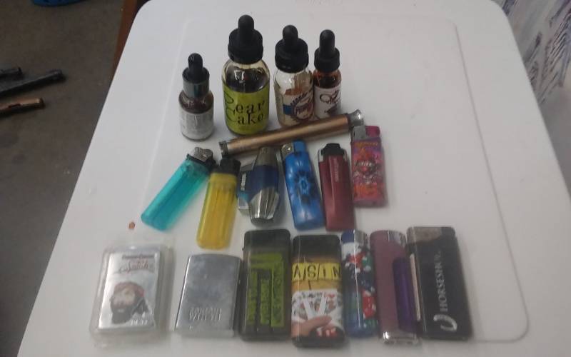 lot 79 image: Lot Of E-Cig Juice, Lighters, Misc Related