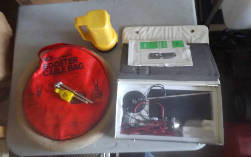 lot 83 image: Jumper Cables, Emergency Radio, Flashlight, Steering Wheel Cover