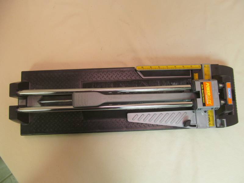 lot 27 image: Plasplugs power glide tile cutter
