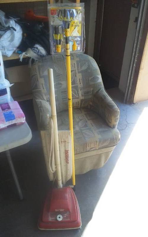 lot 10 image: NEW Light Bulb Changing Tool & Eureka Upright Vacuum