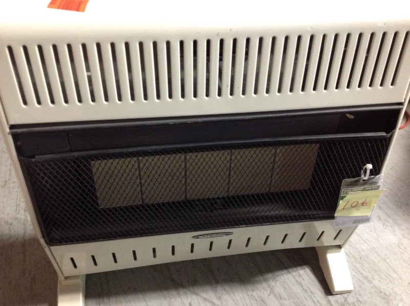 lot 106 image: Reddy Heater 28,000 - 30,000 BTU Infrared Dual-Fuel Wall Heater with Blower in working condition missing small cove see pictures