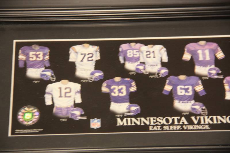 lot 56 image: Minnesota Vikings Evolution of Team Uniforms Framed Photo