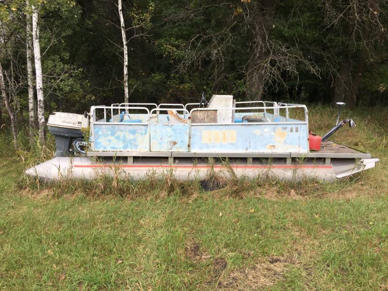 lot 12 image: ALUMACRAFT PONTOON - MODEL # 40ESL69R - ON GROUND- 18 LONG 40 HP JOHNSON MOTOR ON BACK