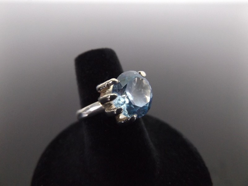 lot 28 image: .925 Sterling Silver Faceted Topaz Hand Cocktail Ring Size 5.75