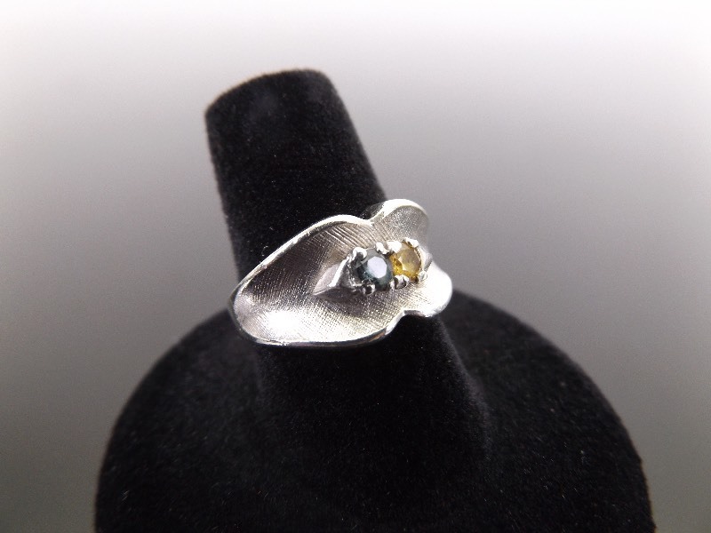 lot 34 image: .925 Sterling Silver Faceted Topaz and Citrine Ring Size 7