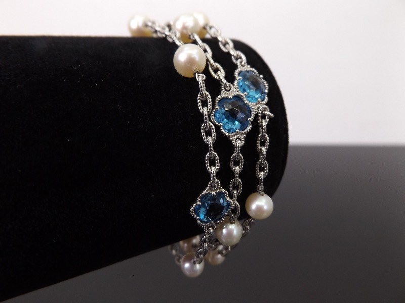 lot 55 image: .925 Sterling Silver Pearl and Blue Crystal Flower Bracelet