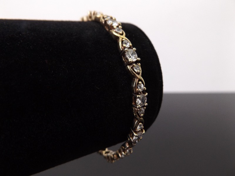 lot 58 image: .925 Sterling Silver Crystal Hugs and Kisses Vermeil Tennis Bracelet
