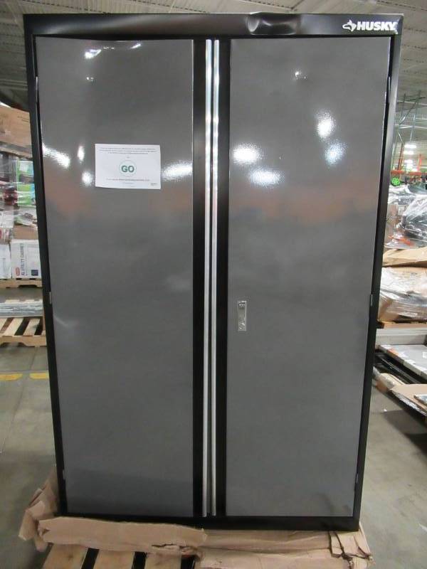 lot 135 image: Husky  72 in. H x 46 in. W x 24 in. D Welded Steel Floor Cabinet in BlackGray, KF3F462472-H9 - Dented top and Doors.