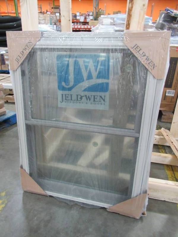 lot 153 image: Jeld-wen 31 12 x 40 12. V-2500 Series Desert Sand Vinyl Double Hung Window with BetterVue Mesh Screen - NEW.