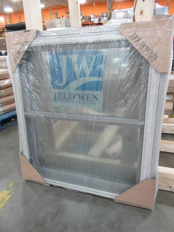 lot 156 image: Jeld-wen 31 12 x 35 12. V-2500 Series Desert Sand Vinyl Double Hung Window with BetterVue Mesh Screen - NEW