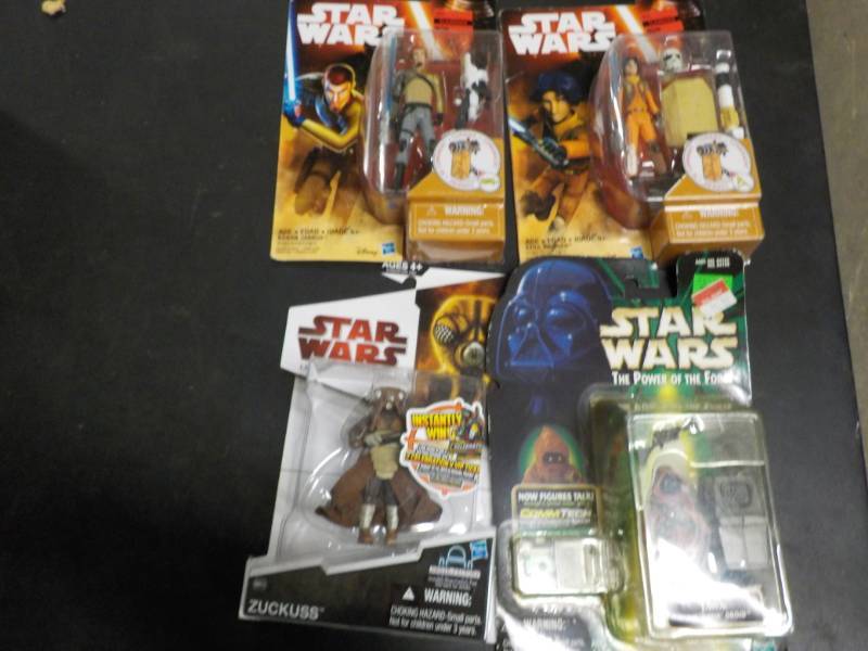 lot 15 image: Star Wars new in package set of 4...
