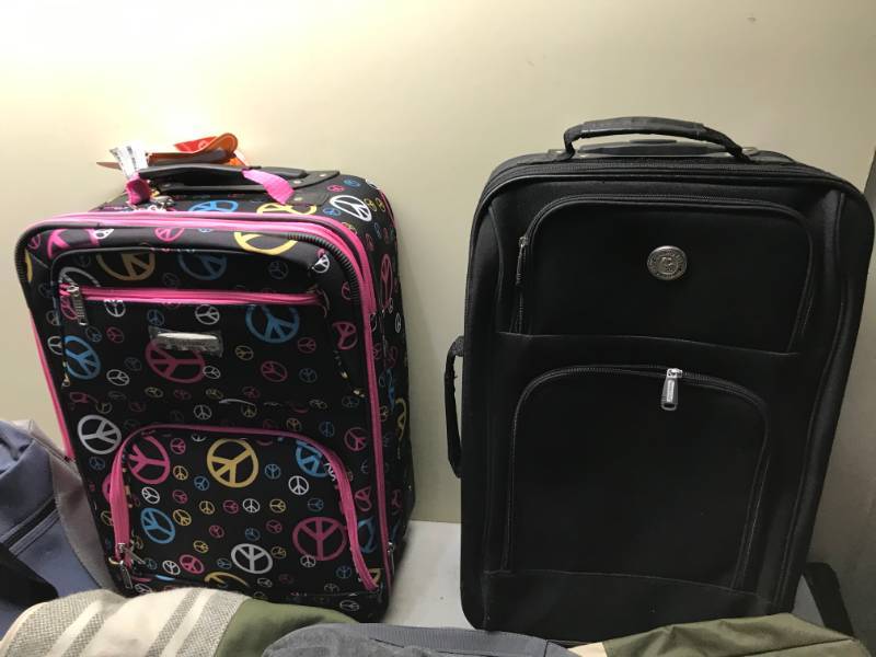 lot 11 image: Lot of Travel Bags And Suitcases, The Peace Sign Rolling Luggage Is Like New