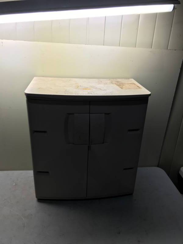 lot 18 image: Rubbermaid Plastic Storage Garage Cabinet Shelf, Used, Some Wear, Needs Wipe Down