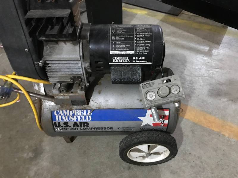 lot 15 image: Campbell Hausfeld 2.5 Horsepower Air Compressor, Not Working Right, Powers On, Make Hissing Noise When Unplugged, As Is For Parts