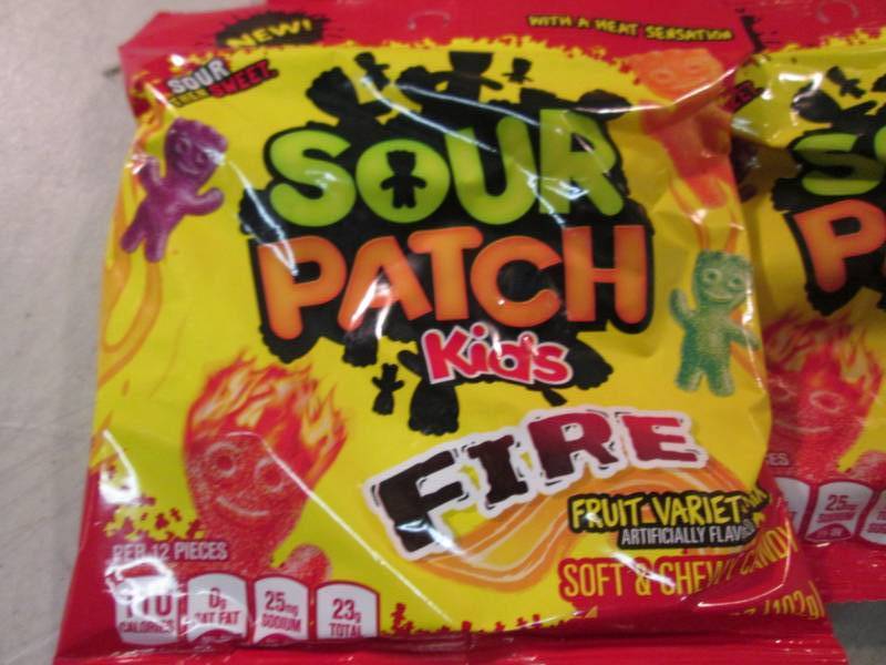 lot 128 image: 12 Bags of Sour Patch Kids Fire Can...