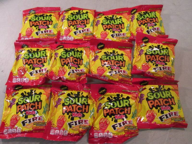 lot 141 image: 12 Bags of Sour Patch Kids Fire Can...