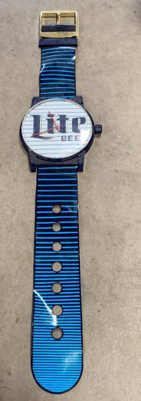 lot 21 image: Miller Lite 67 Long Watch Collectible from 1990
