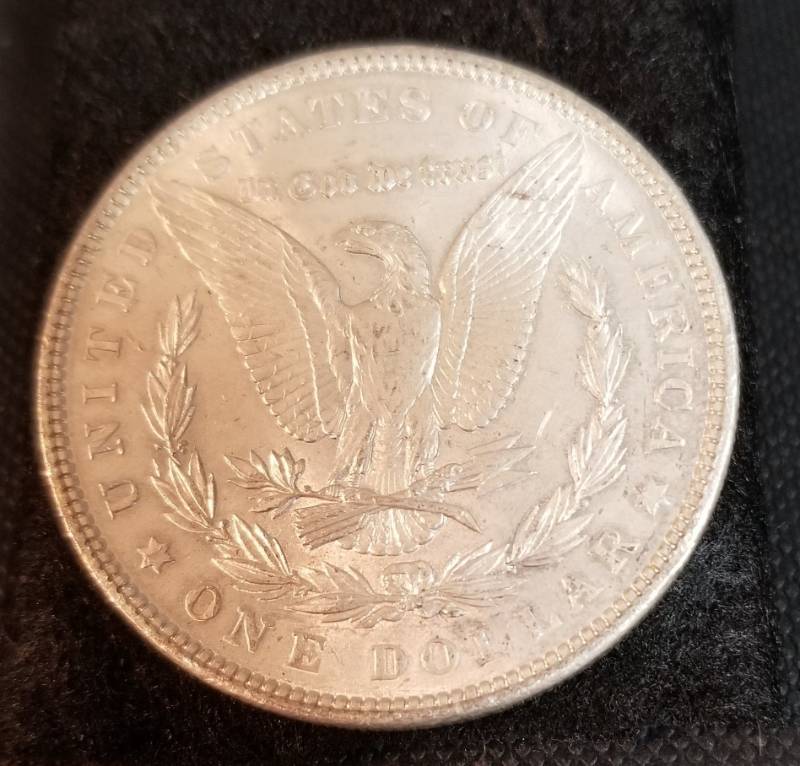 1902 MORGAN SILVER DOLLAR coin looks much better in hand