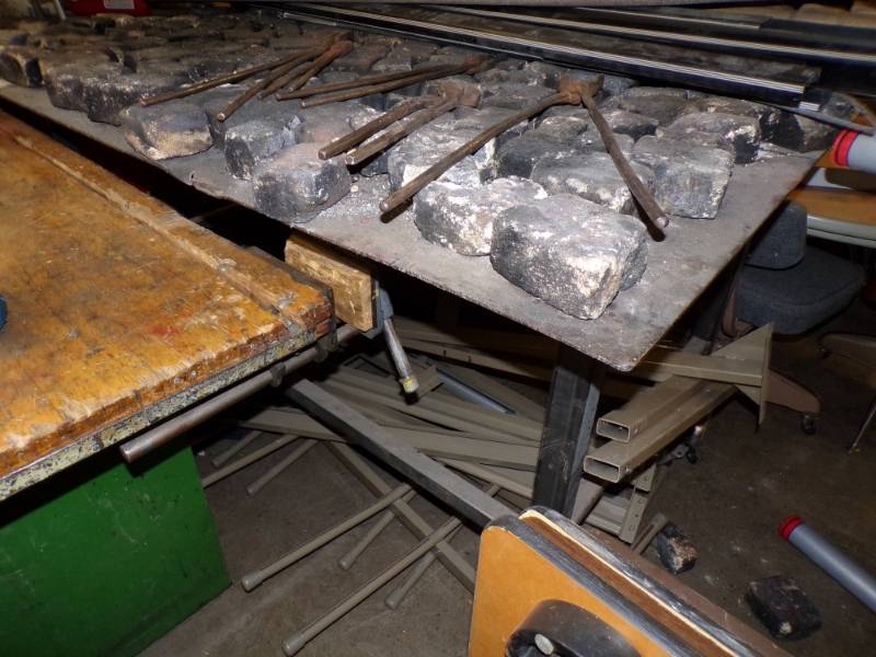 lot 76 image: Blacksmiths Table with tools and bricks