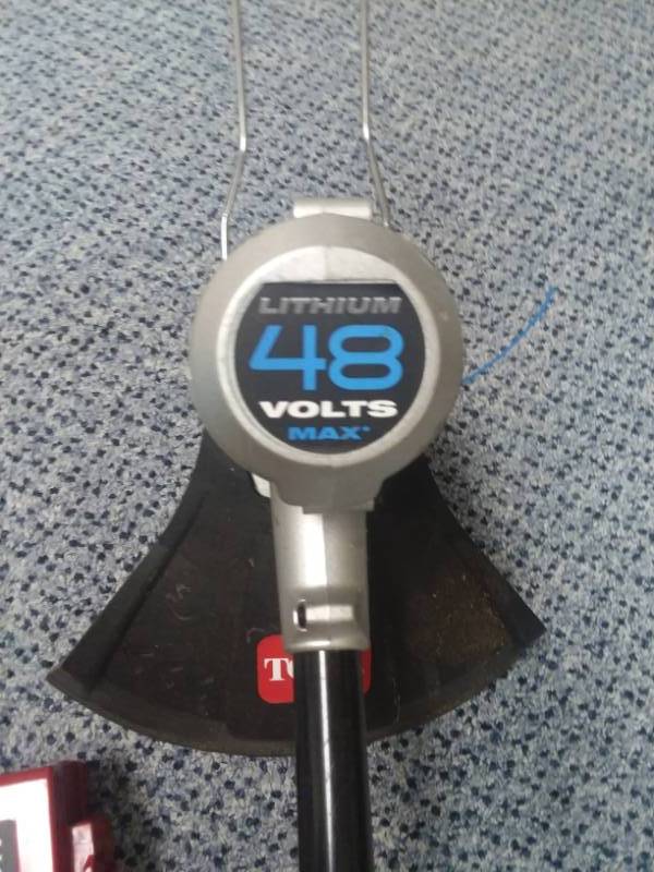 lot 11 image: Toro 48v Lithium Weed Trimmer  like new.