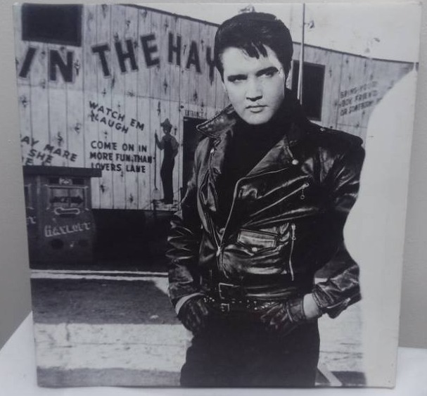 lot 16 image: Misc. Metal and Elvis Dcor.