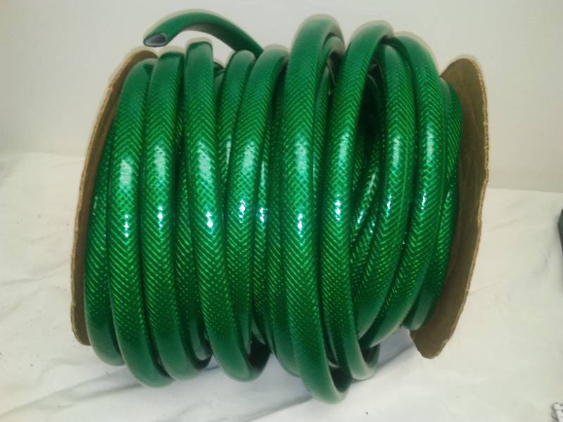 lot 52 image: 100 feet of garden hose - no ends.