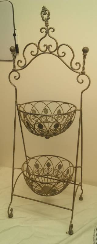 lot 77 image: Metal baskets on frame.