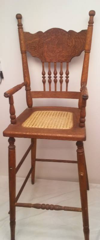 lot 82 image: Vintage cane seat highchair with dolls