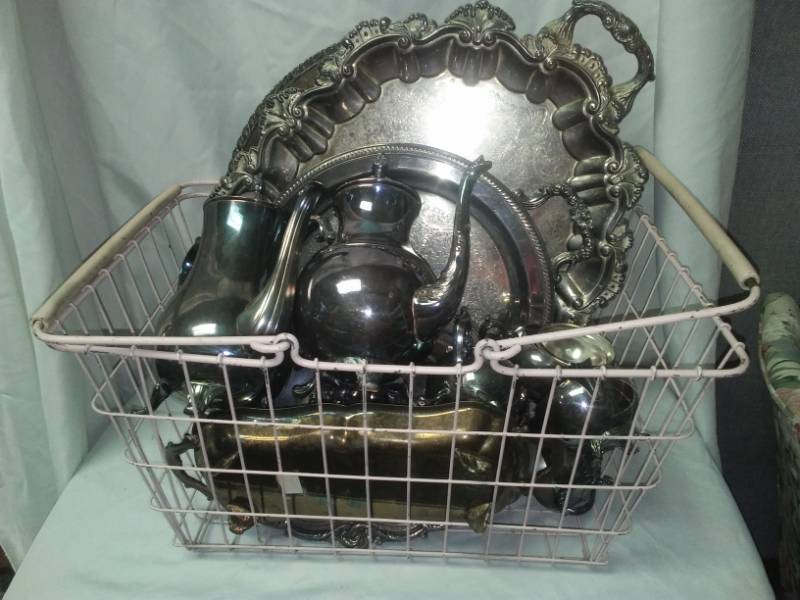 lot 375 image: Vintage pink metal basket and silver plated serving pieces.