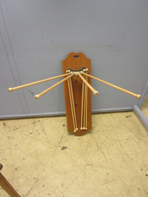 lot 210 image: TWO ANTIQUE LAUNDRY DRYING RACKS AND CLOTHESPINS
