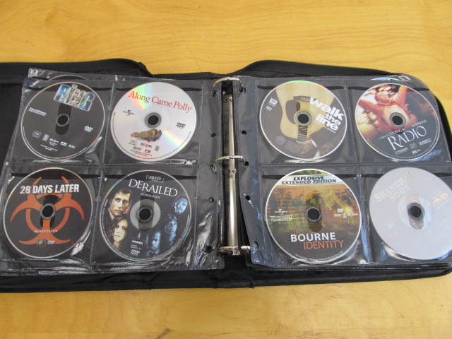 lot 167 image: Book Full of DVDs - Approx 100 Movies