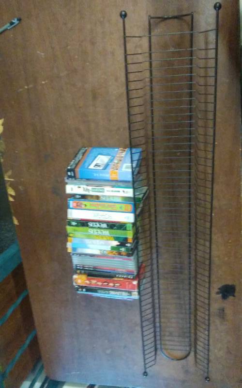 lot 26 image: Lot Of TV Series DVDs, Includes Storage Rack