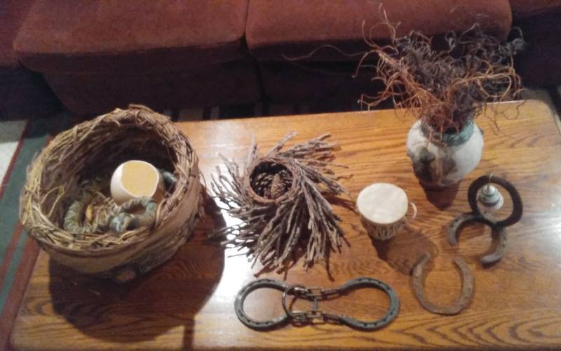 lot 138 image: Snake In A Basket, Willow Basket With Pine Cones, Leather Drum, Curly Willow Centerpiece, Horse Shoes