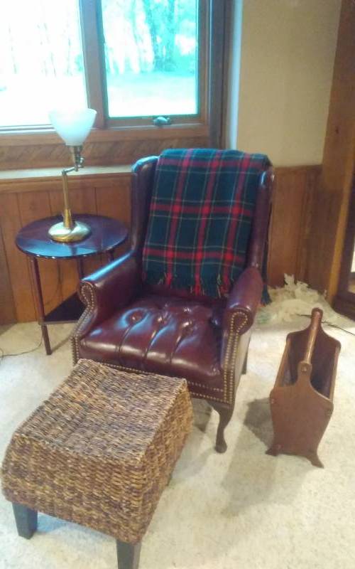 lot 158 image: Round Table 20x24, Brass Lamp (Really Heavy), Brass Tack Wing Back Chair, Wicker Ottoman, Mag Rack