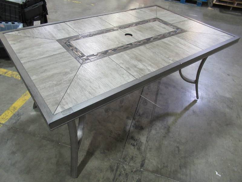 lot 109 image: PATIO TABLE - Grouted Porcelain Tile Top With Umbrella Hole and Alumicast Frame - Small hole on edge (See Photo)